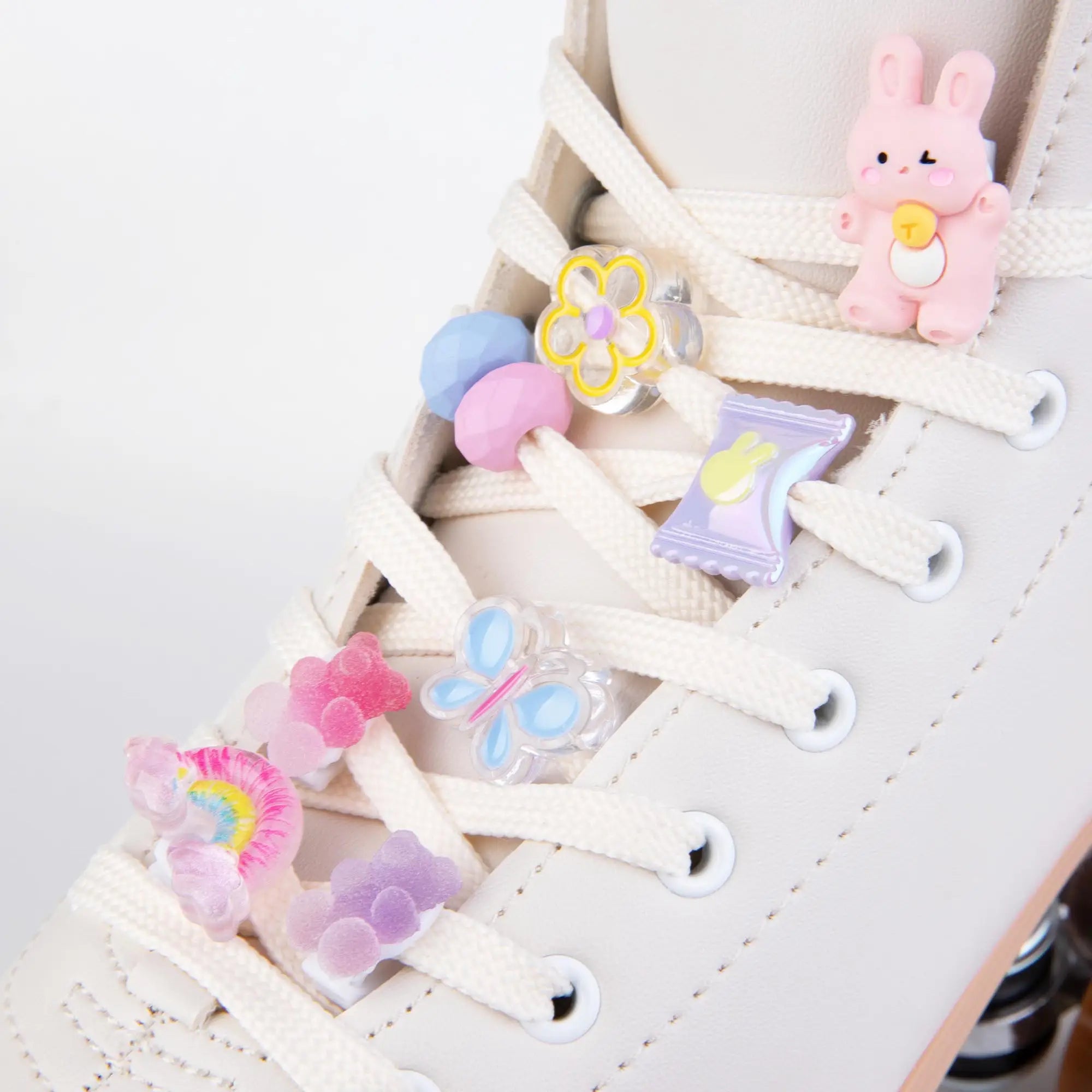 Colorful shoe lace clips on a white roller skates