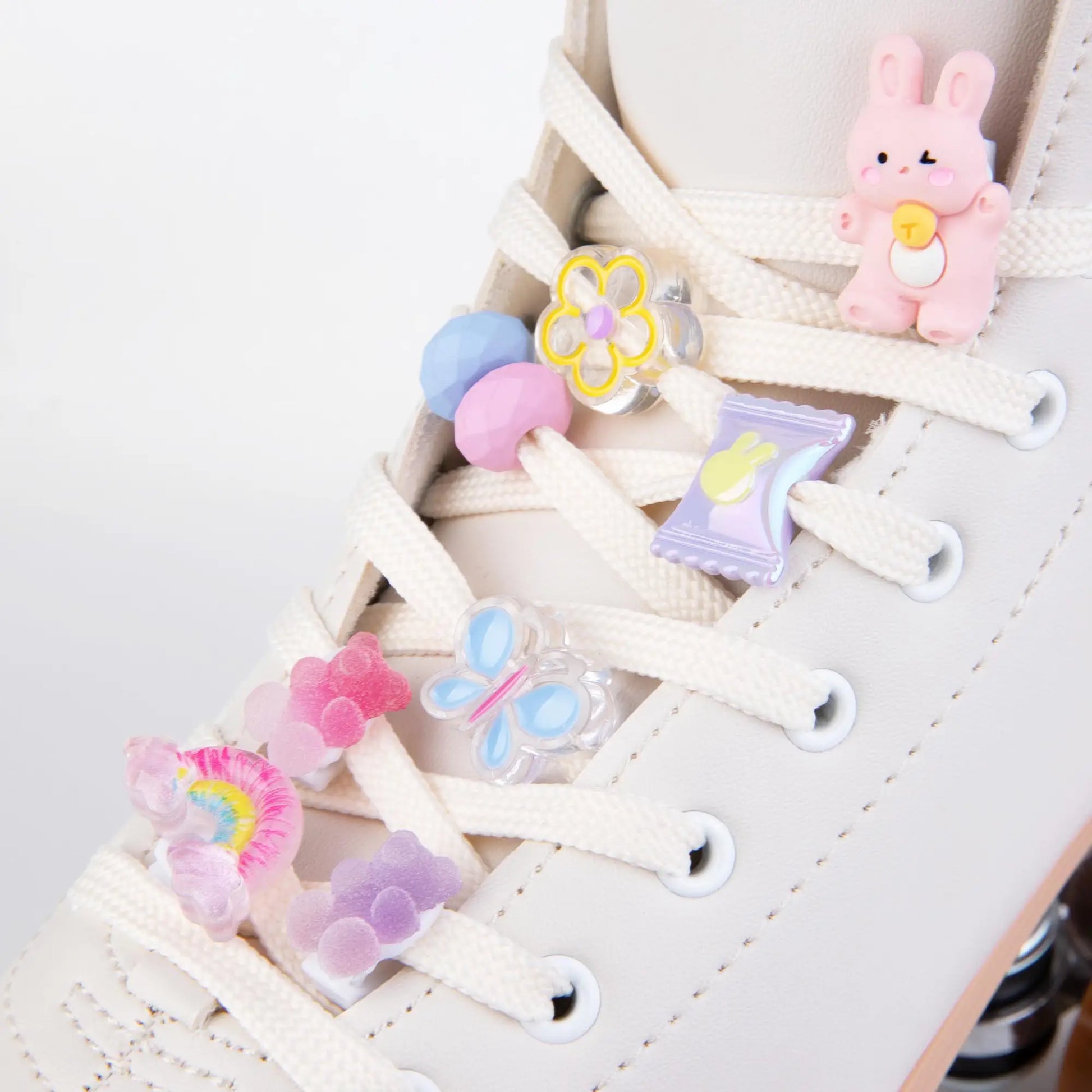 Colorful shoe lace clips on a white roller skates