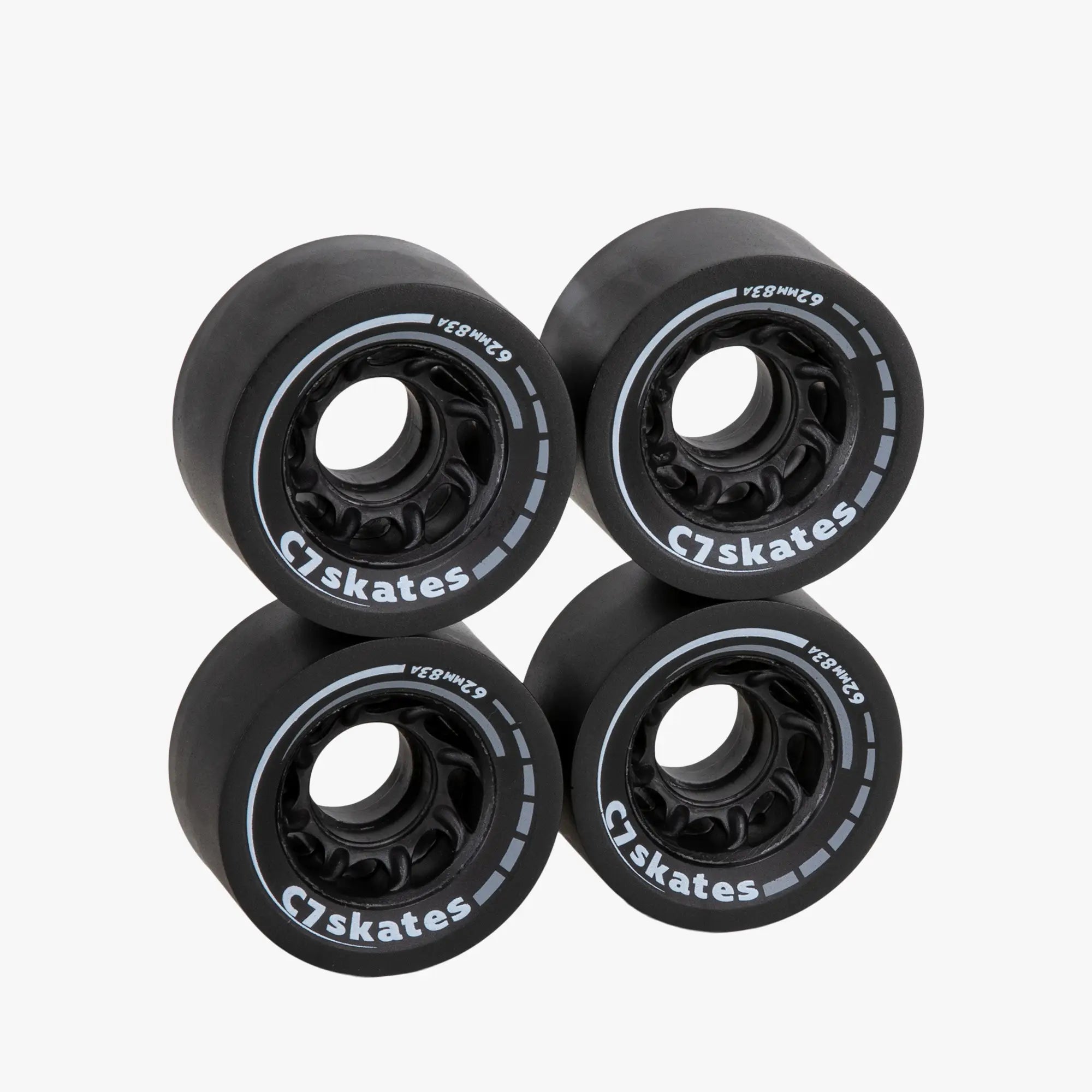 Four black C7 skates wheels on a white background