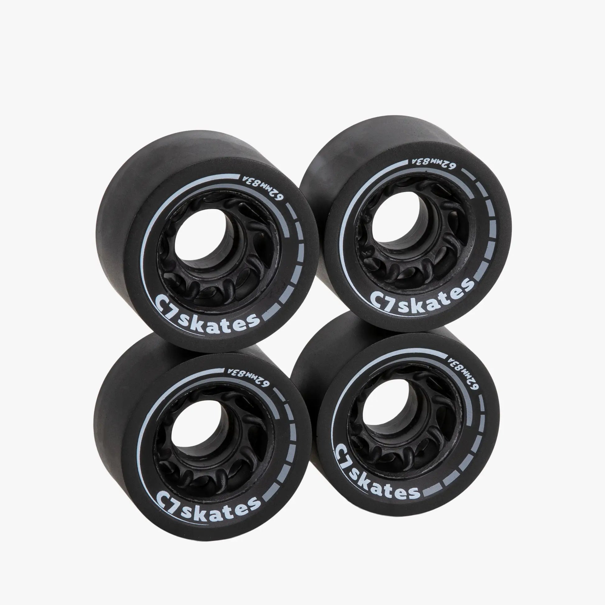 Four black C7 skates wheels on a white background