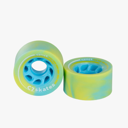 Two tie-dye skateboard wheels with blue and green colors on a white background