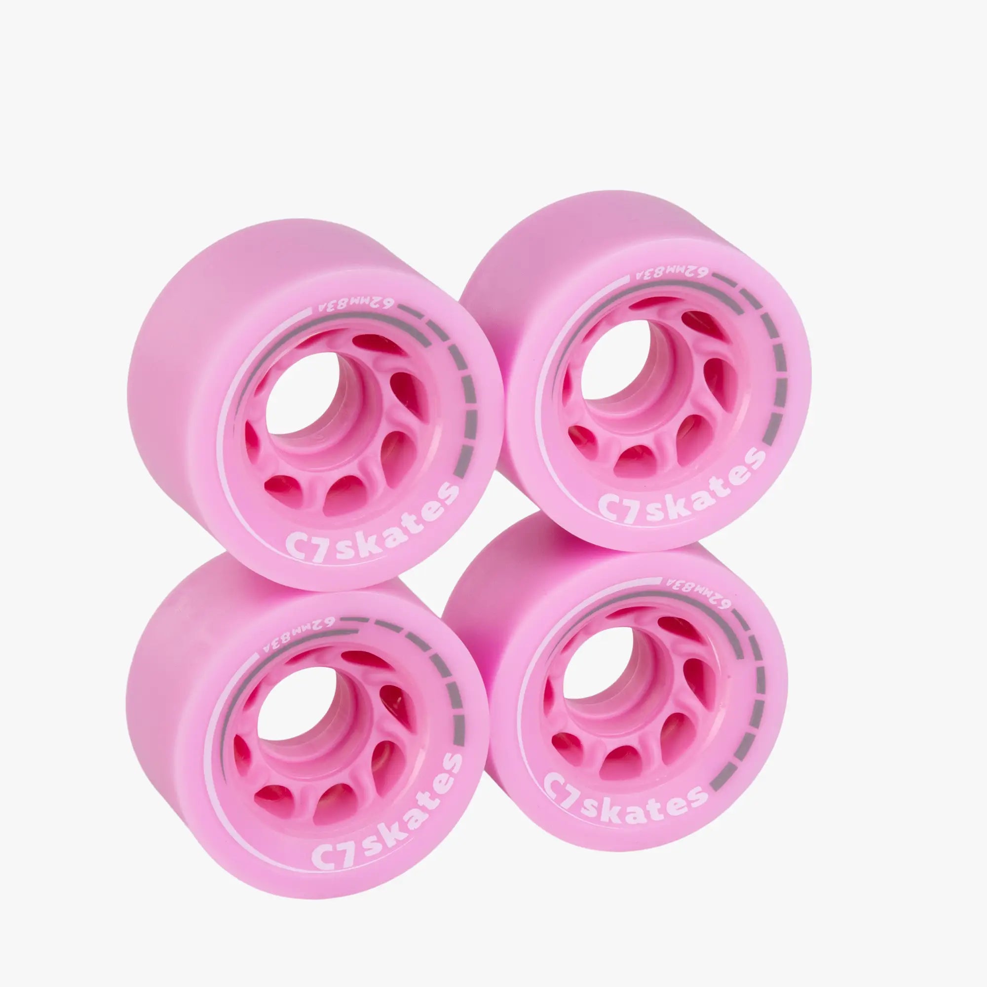 Four pink roller skate wheels with 'C7skates' branding on a white background