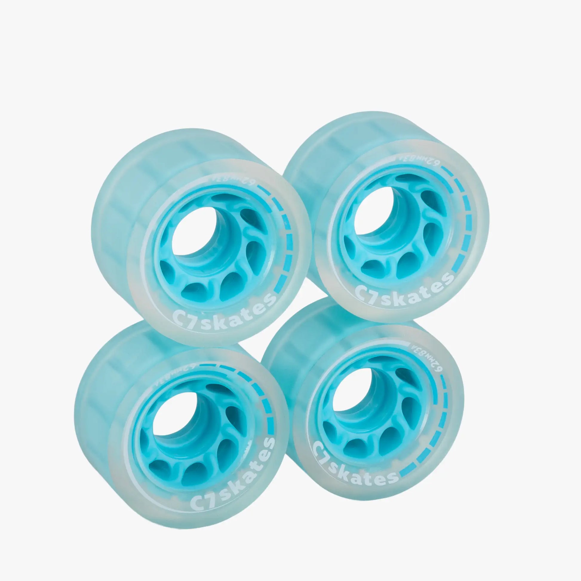Four turquoise roller skate wheels on a white background