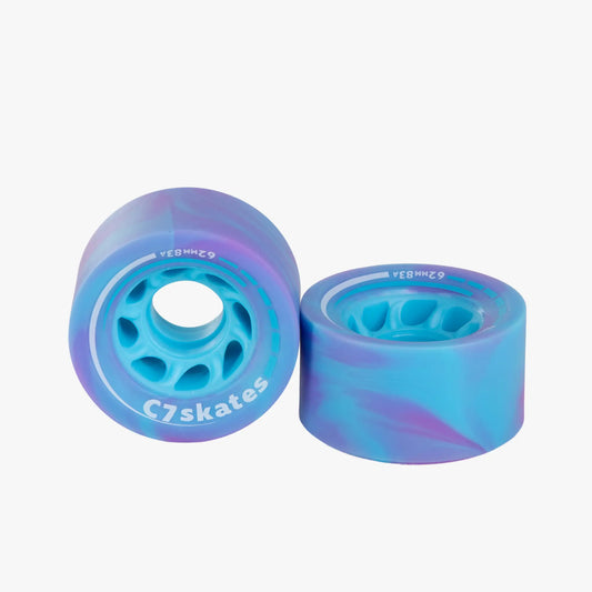 Two blue and purple C7 skates wheels on a white background