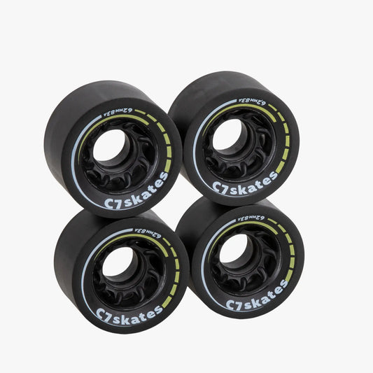 Four black C7skates wheels on a white background