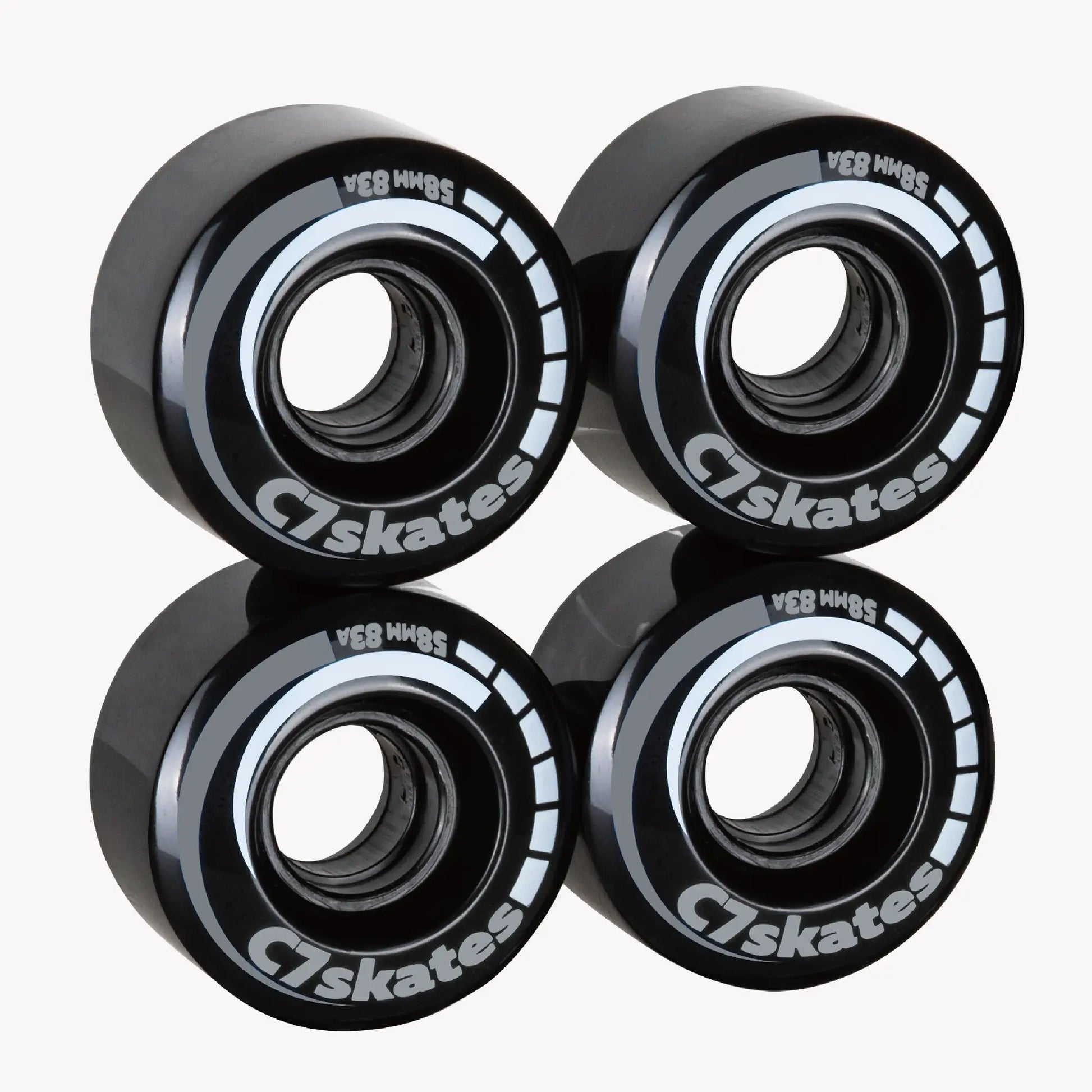 Four black C7 skates wheels on a white background