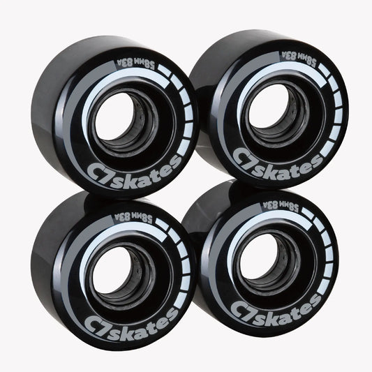 Four black C7 skates wheels on a white background