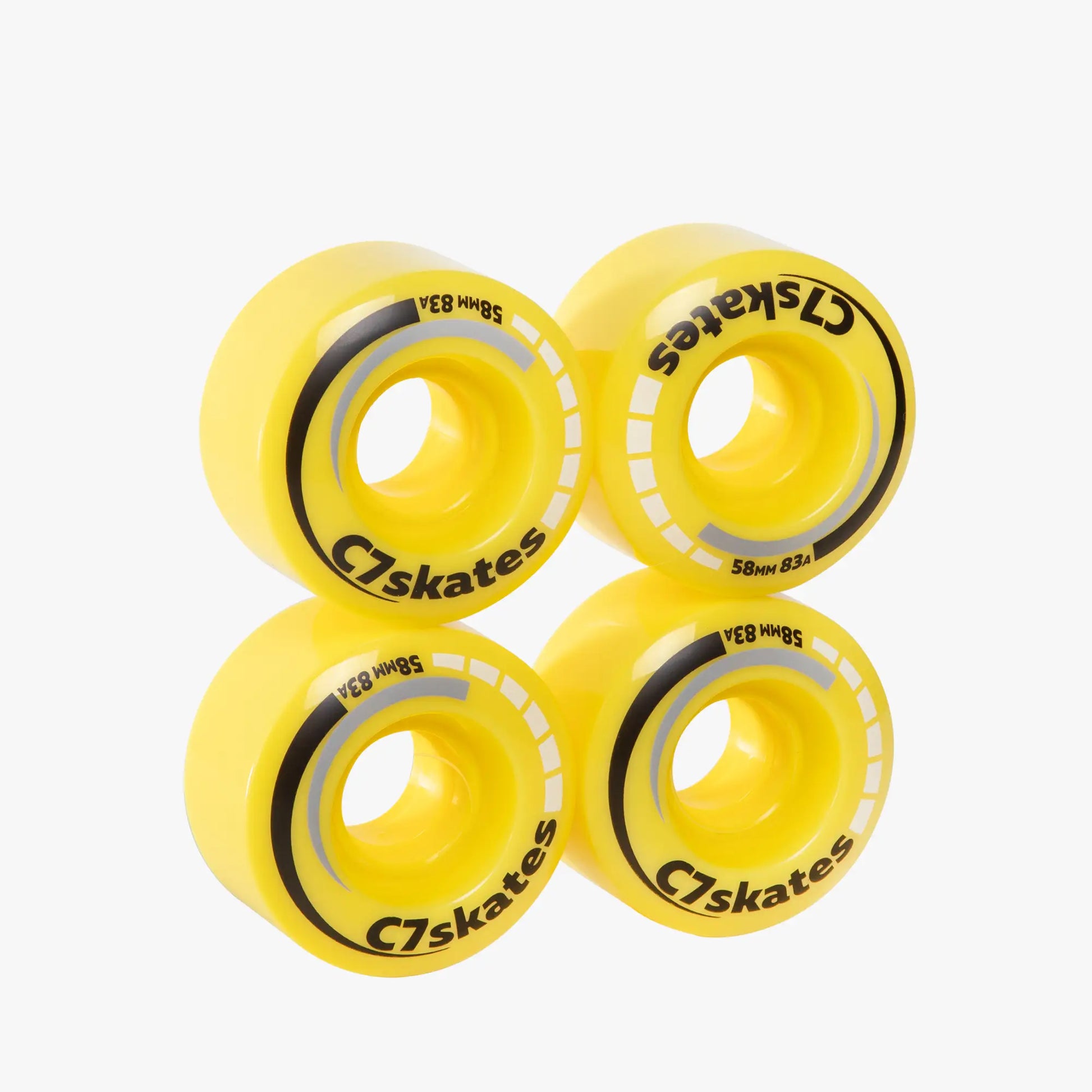 Four yellow wheels with black and white text on a white background