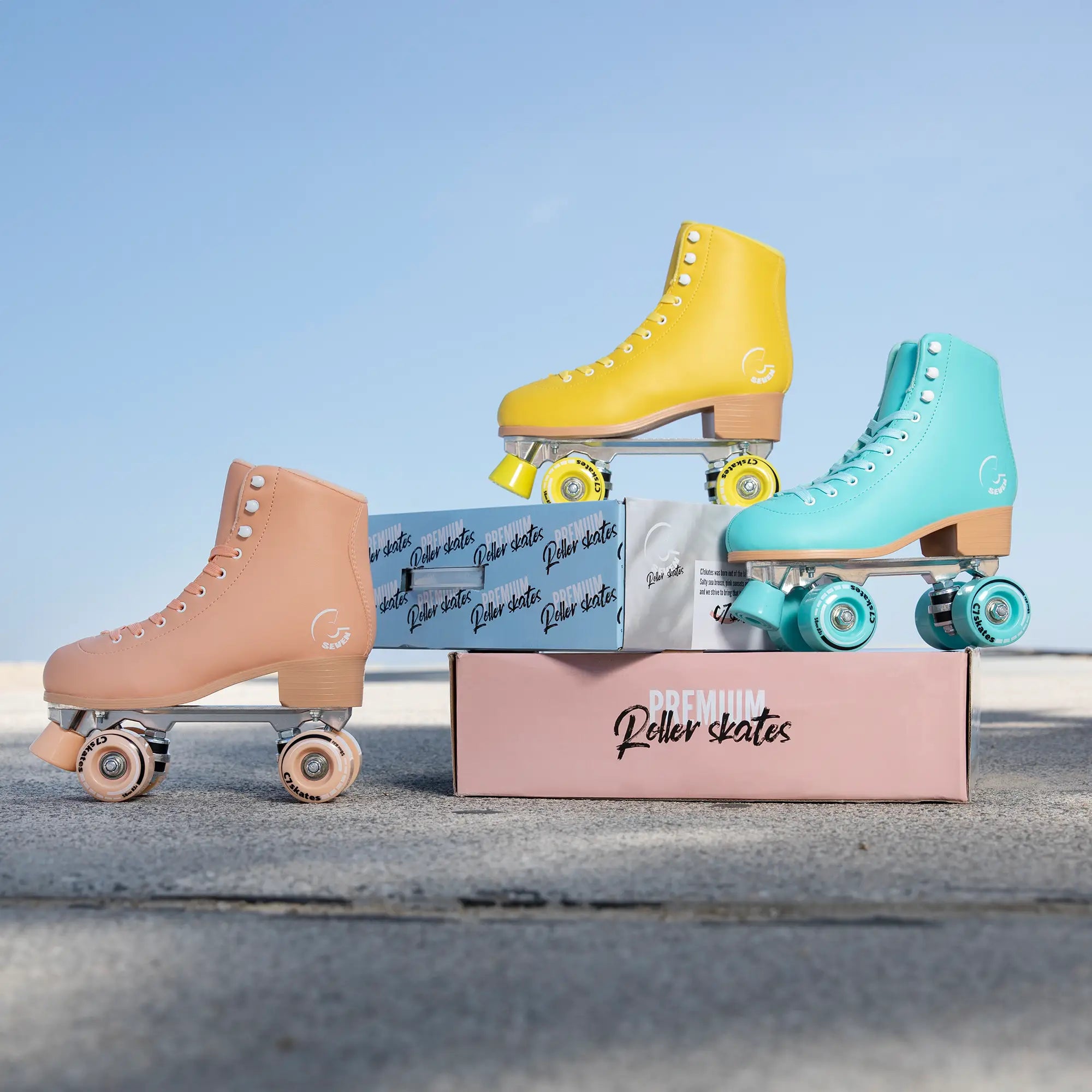 Colorful roller skates with packaging on a clear sky background