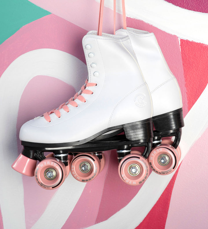 retro white roller skates with candy pink laces and wheels
