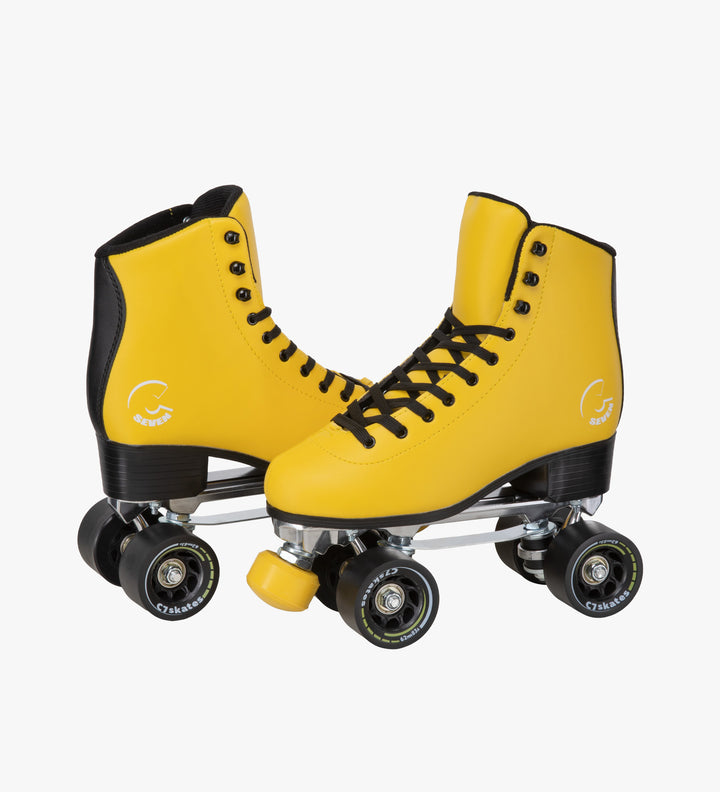The C7skates Queen Bee Quad Skates feature a black and yellow color, removable toe stops, 62mm wheels and a structured boot. 